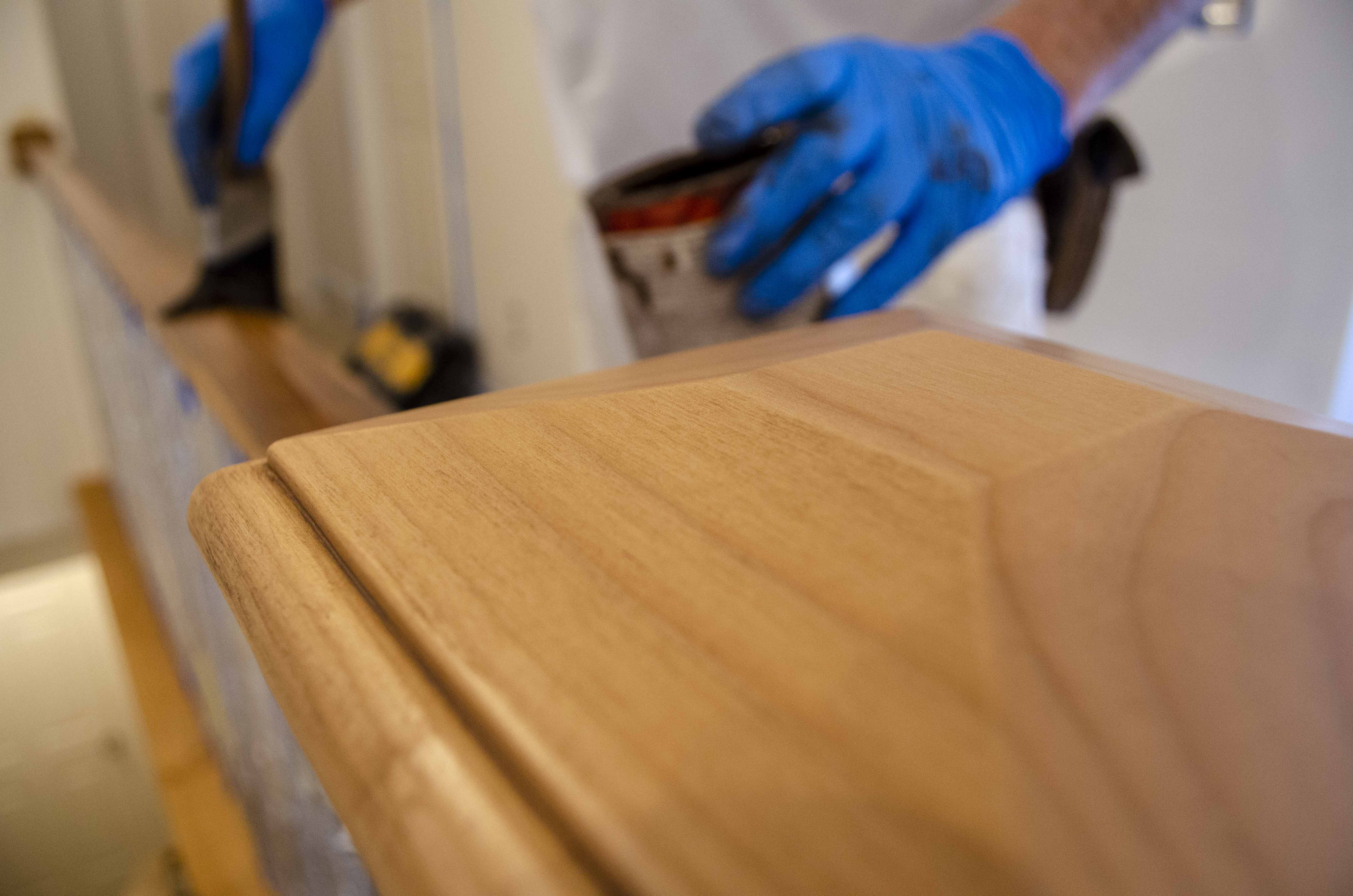 wood railing being stained